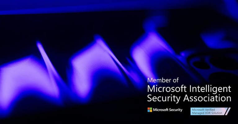 Abstract purple and blue light waves with Microsoft Security branding, stating ‘Member of Microsoft Intelligent Security Association’ and ‘Microsoft Verified Managed XDR Solution