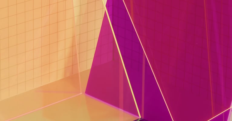 Abstract purple and gold geometric shapes representing data governance, security and digital transformation.