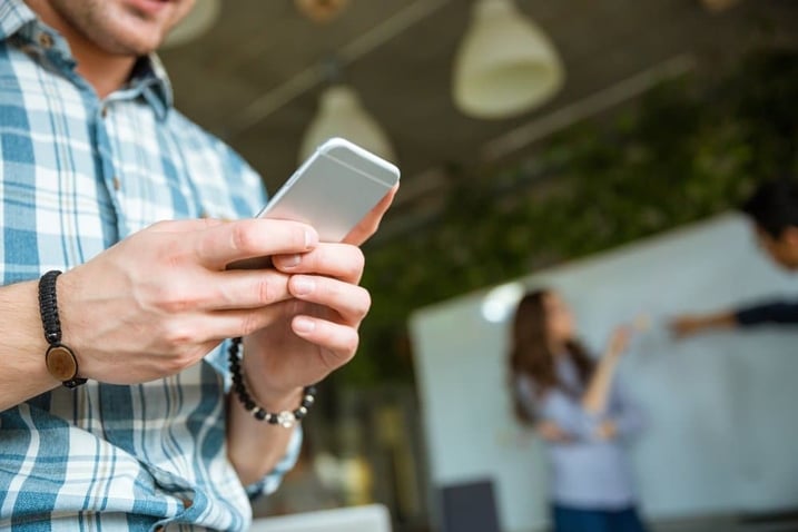 Young-Man-in-Shirt-Using-mobile-Phone